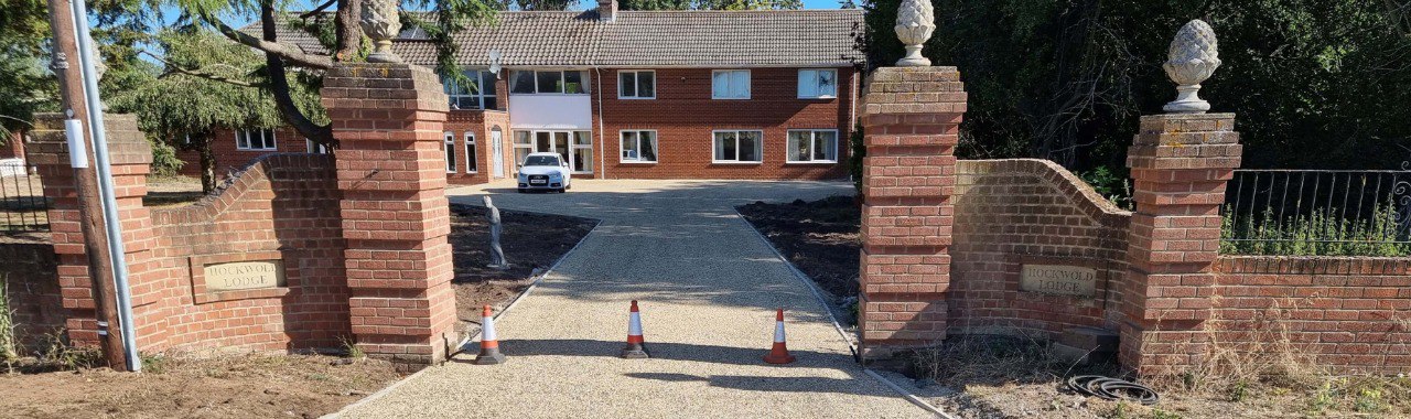 This is a photo of a newly installed chip and tar driveway, installed by Huntingdon Driveways